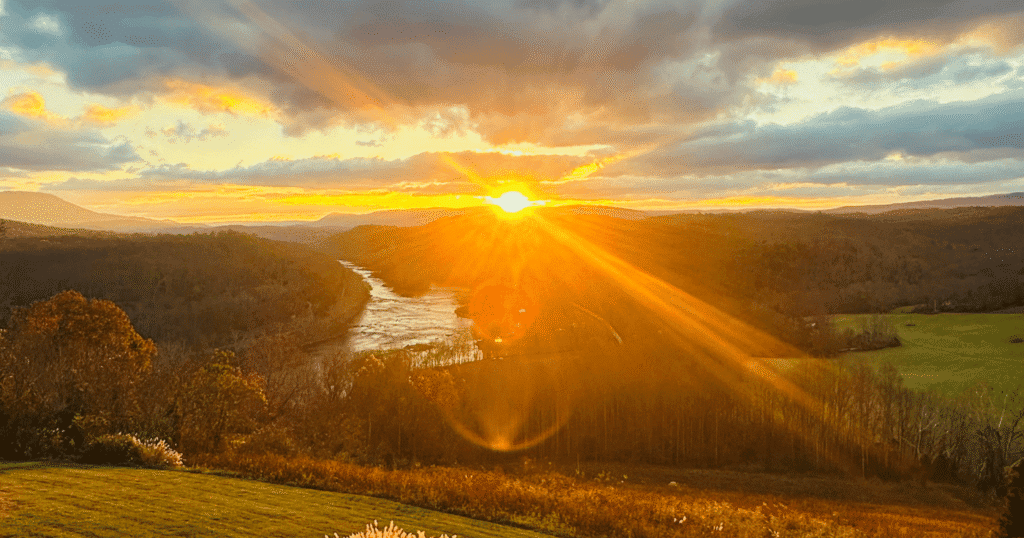 Image of sunrise over new river in virginia from Lilly Valley Inn